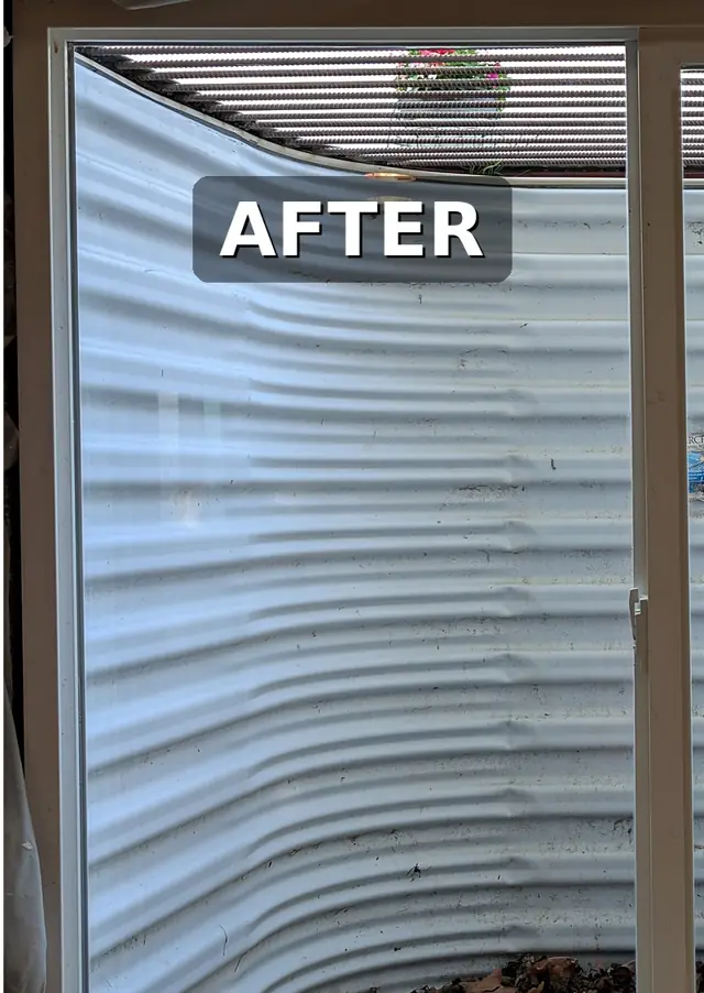 The same window clear after hard water treatment